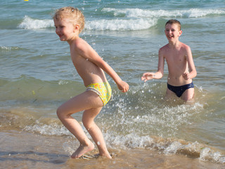 children swim in the sea