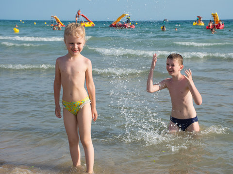 children playing on the beach