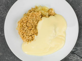 Apple Crumble Dessert Served With Hot Custard