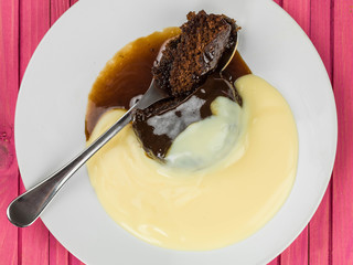 Sticky Toffee Pudding Dessert Served With Hot Custard