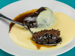 Sticky Toffee Pudding Dessert Served With Hot Custard