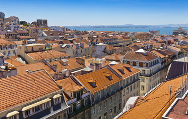 Fototapeta na wymiar Skyline aerial view of Lisbon city in a sunny summer day, Portugal. View from Miradouro do Elevador de Santa Justa