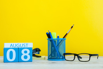 August 8th. Image of august 8, calendar on yellow background with office supplies. Summer time