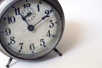 old clock on a white background