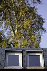 Summer sun reflection on attic windows