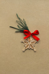 Merry christmas / Creative christmas concept photo of a snowflake made of qulling paper on brown background.