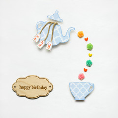Happy birthday / Creative concept photo of a teapot made of paper on white background.