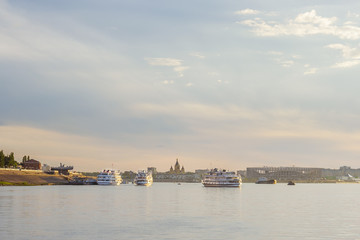 Motor ships go on a cruise along the Volga from the pier in Nizhny Novgorod