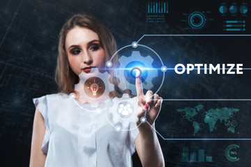The concept of business, technology, the Internet and the network. A young entrepreneur working on a virtual screen of the future and sees the inscription: Optimize