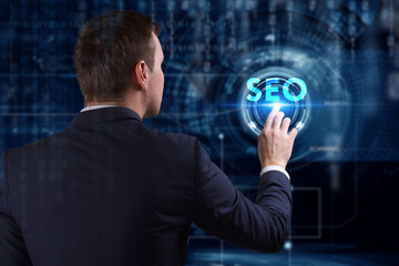 Business, Technology, Internet and network concept. Young businessman working on a virtual screen of the future and sees the inscription: SEO