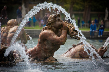 Fototapeta na wymiar Apollo fountain in the castle gardens of Versailles
