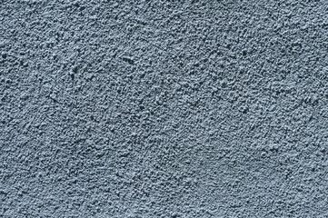Blue painted plastered house wall facade surface closeup as background