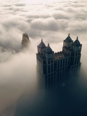 Naklejka na ściany i meble Elevated View Of Skyscrapers In Clouds