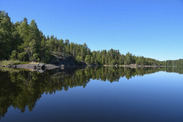 Fototapeta na wymiar Beautiful lake view and forest landscape in Finland.