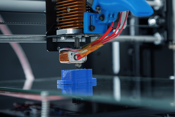 Electronic three dimensional plastic printer during work , 3D , printing.