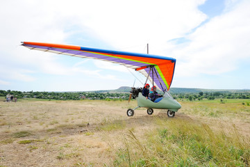 Beautiful color hang-glider soars into the sky