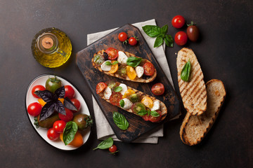 Bruschetta with tomatoes, mozzarella and basil