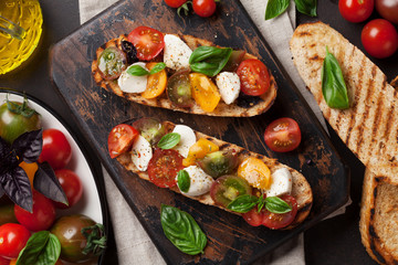 Bruschetta with tomatoes, mozzarella and basil
