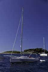 Sailboat at mooring in harbor of Hvar, Croatia