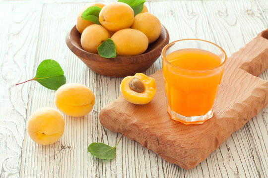 Ripe apricots and apricot juice
