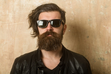 Obraz premium Hipster in leather jacket and glasses.