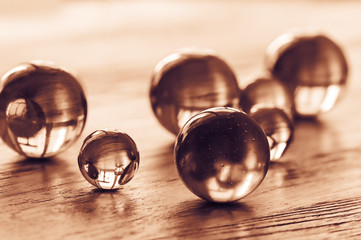 Glass balls of different sizes tinted in gold.