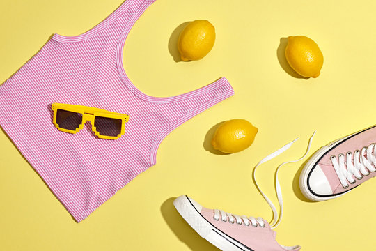 Fashion Summer Hipster Accessories Set. Lemon Citrus fruit, Trendy Sneakers, Top, fashion Sunglasses on Yellow. Hot Summer Sunny Vibes. Creative Bright Style. Vanilla Pastel Color. Minimal, Art