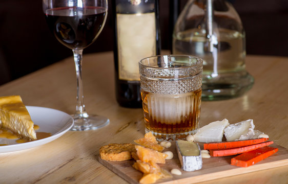 Cheese snacks and alcohol on the table in the restaurant