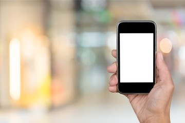 Hand holds phone.