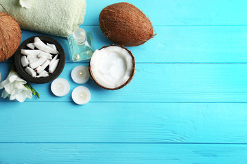Set for spa treatment with coconut on wooden background