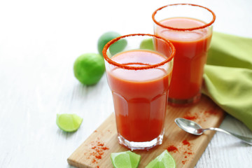 Delicious cocktails with tequila on wooden board