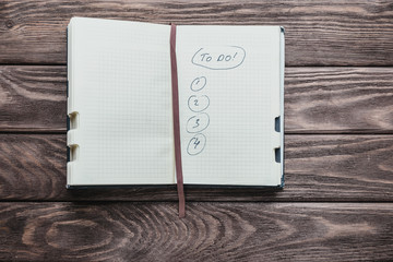 Notebook with to do list.