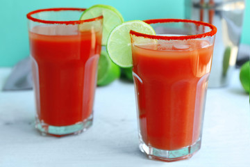 Delicious cocktail with tequila in glasses on table