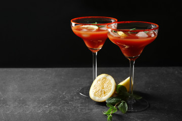 Delicious cocktails with tequila on black background