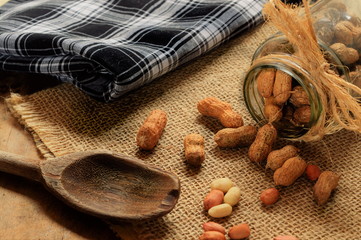 Raw peanuts in bowl on the table