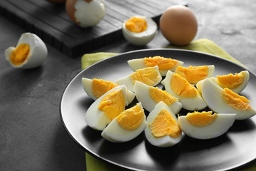 Plate with hard boiled eggs on table. Nutrition concept
