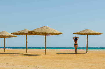 One girl on a deserted beach