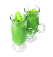 Glasses of fresh vegetable juice on white background