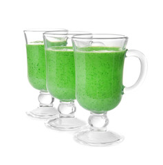 Glasses of fresh  juice on white background