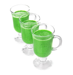 Glasses of fresh  juice on white background