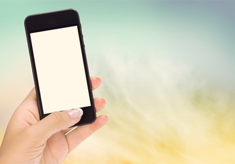 Hand holds phone.