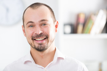 Positive young man in office