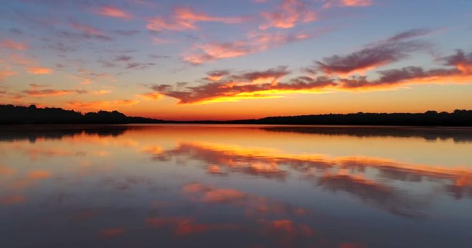 Flying toward tranquil twilight sky, aerial view.
