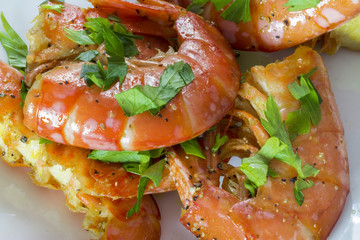 Some king prawns without heads.