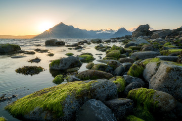 Sunset view of Black Cuillin mountains from rocky Elgol beach © Roelof