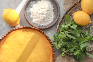 Composition with tasty lemon curd pie on table