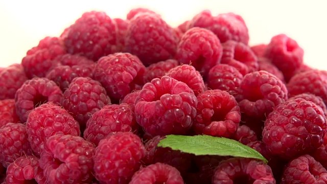  Raspberry. Juicy fresh Raspberry on a white background rotates. Raspberries is spinning 360. Looping is possible.  High speed camera shot. Full HD 1080p.