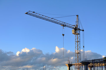 Fototapeta na wymiar Construction crane against the blue sky