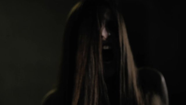 Woman zombie walking and smelling like a predator slow motion film color correction