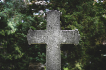 Stone cross gravestones on cemetery - graveyard